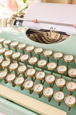 A mint-green vintage typewriter